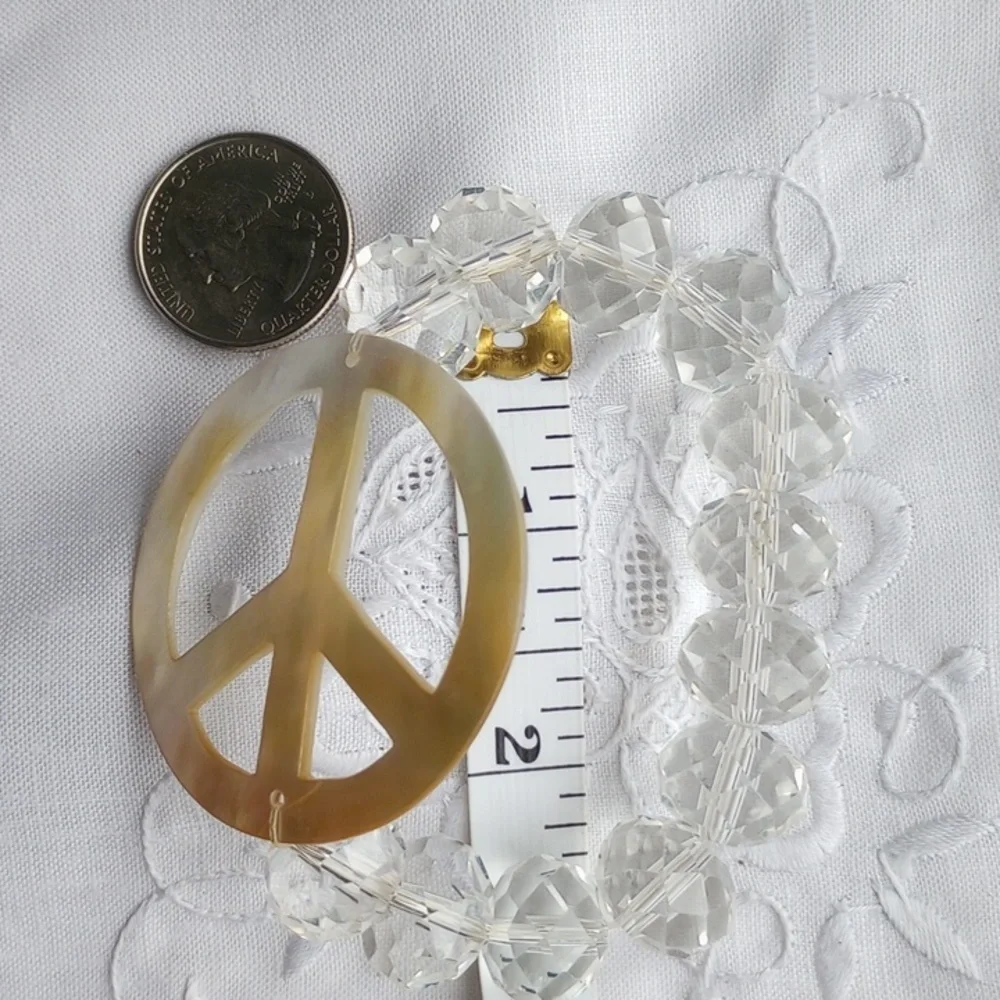 Large faceted Crystal beads w mother of pearl peace sign stretch bracelet